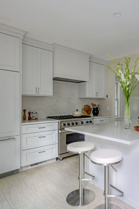 Minimalist, contemporary and urban penthouse interior home office design by Orlie Katsiris Staging & Interiors featuring modern furniture, a black standing desk, white ergonomic chair, and a gray geometric area rug