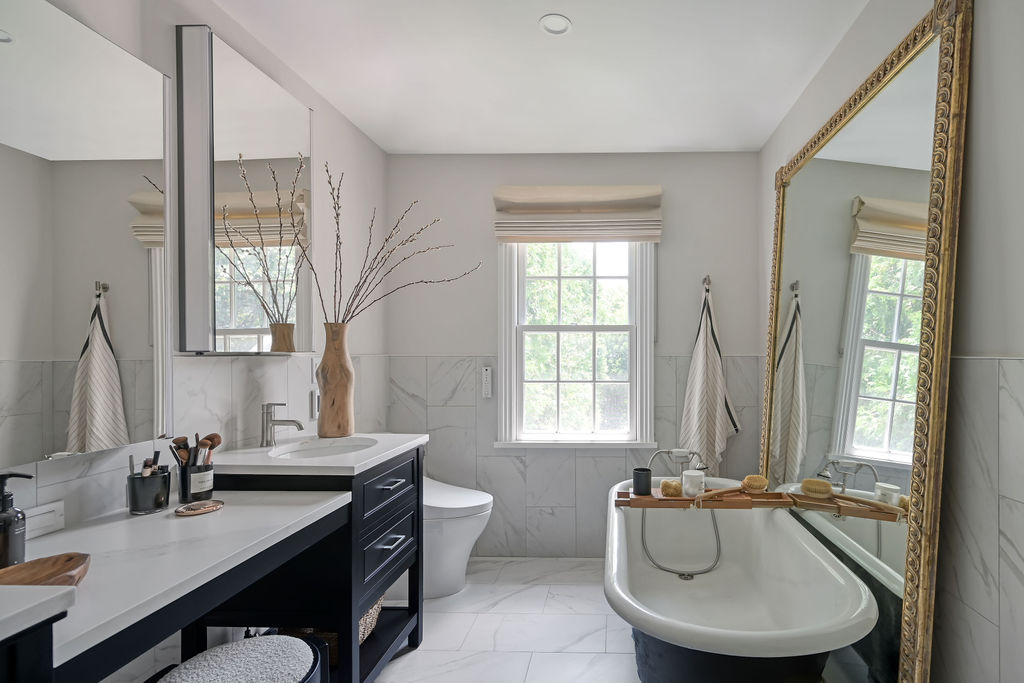 Hudson Yards Manhattan living room interior design by Orlie Katsiris Staging & Interiors featuring modern, minimalist, plush, neutral-toned furniture.