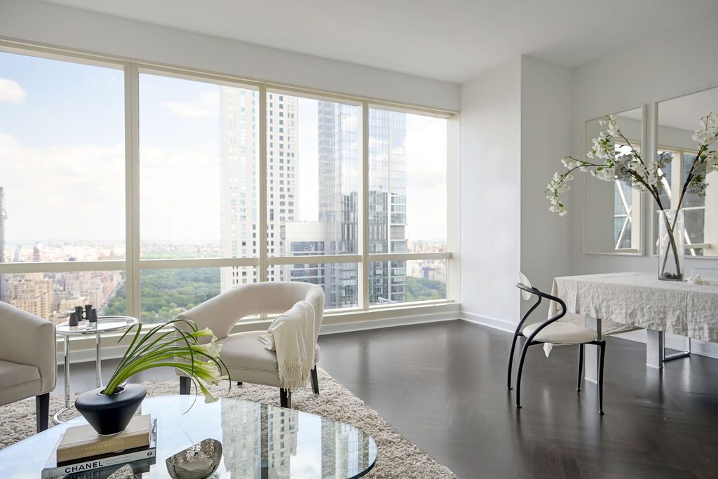 Hudson Yards Manhattan living room interior design by Orlie Katsiris Staging & Interiors featuring modern, minimalist, plush, neutral-toned furniture.