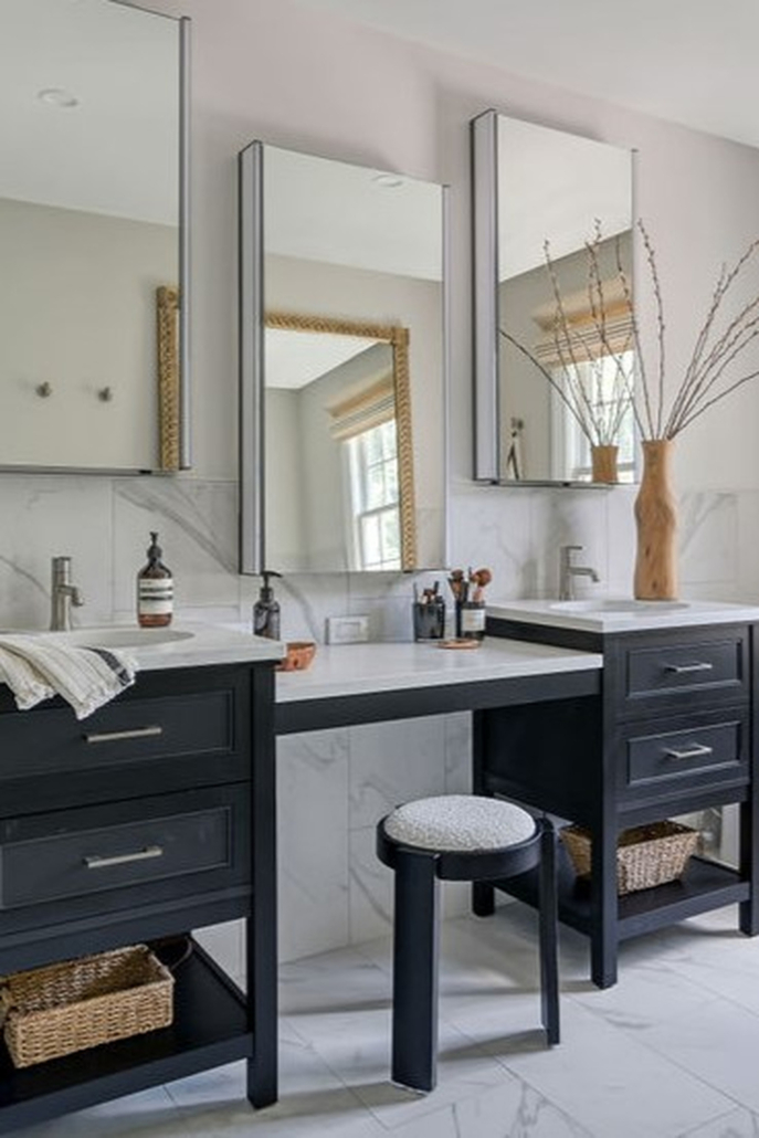 Minimalist, contemporary and urban penthouse interior home office design by Orlie Katsiris Staging & Interiors featuring modern furniture, a black standing desk, white ergonomic chair, and a gray geometric area rug
